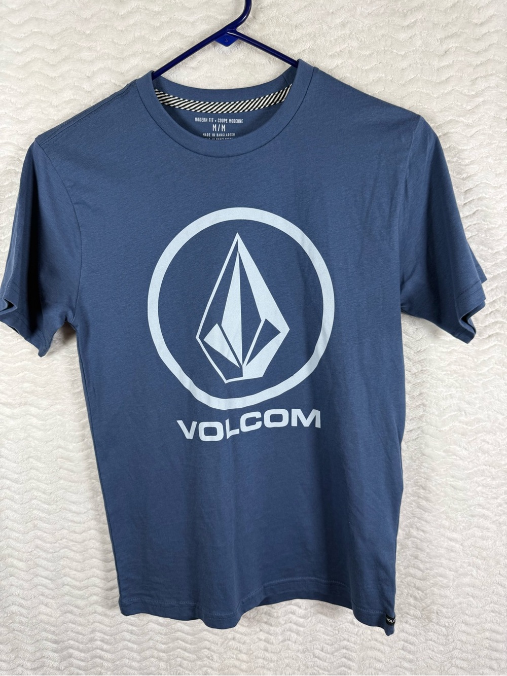 Volcom Crisp Stone Short Sleeve T-Shirt in a slate or navy blue colorway.